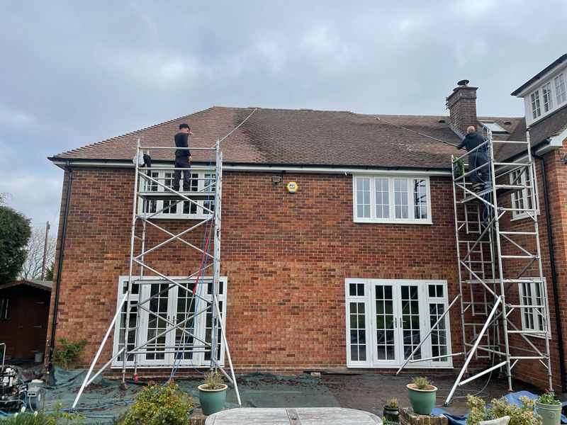 Roof cleaning carried out safely from scaffold towers by The Roof Moss Cleaners in Wheatley